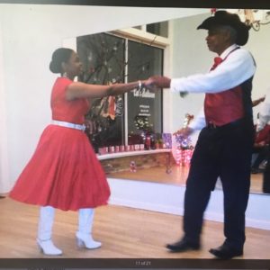 couple dressed in western attire dancing swing - about Cat's Ballroom testimonial