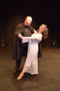 woman and man in phantom of the opera costumes hitting a dance pose - choreography from Cat's Ballroom