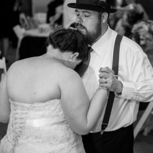 Melissa leans her head on Barry's chest during their first dance.