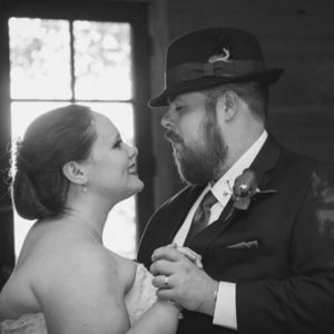 Melissa & Barry gaze into each other's eyes during their first dance.