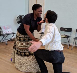 woman bending down to man on knee