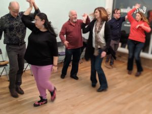 Group of people dancing in a class at Cat's Ballroom.