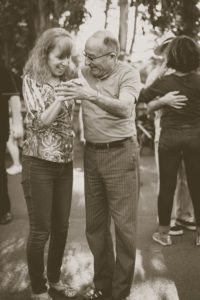 older couple dancing and smiling