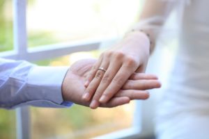 close up of a couple holding hands