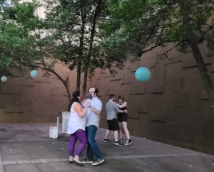Couples dancing outside in the sunken mall behind the Downtown Memphis Commission building during free class by Cat's Ballroom