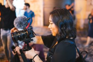 woman looking at video camera 