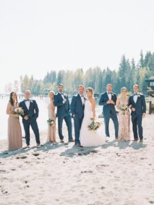wedding party posing on beach - Kari & Camron's first dance