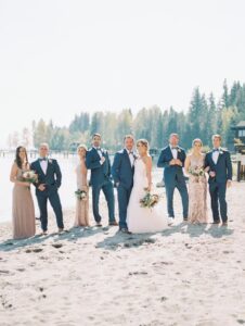 wedding party posing on beach - Kari & Camron's first dance