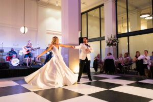 bride and groom entertaining friends with their first dance