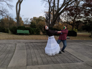 Couple striking a dance pose.