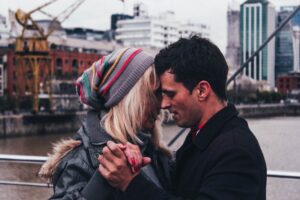 couple dancing on a bridge