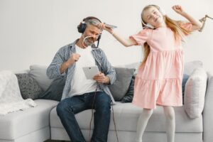 father and daughter listening to music