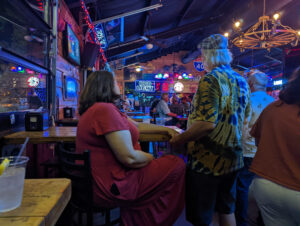 couple holding hands in a bar