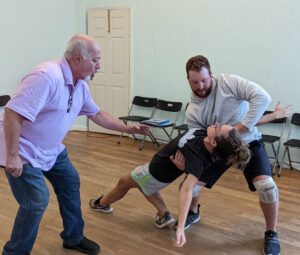 Couple learning a tricky move for their first dance.