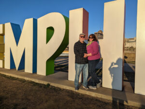 Couple posing in front of Memphis sign.