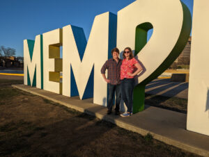 Couple posing in front of Memphis sign.