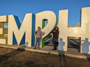 Friends posing in front of Memphis sign.
