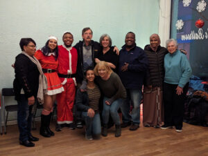 Friends and family of dancers posing for group shot.